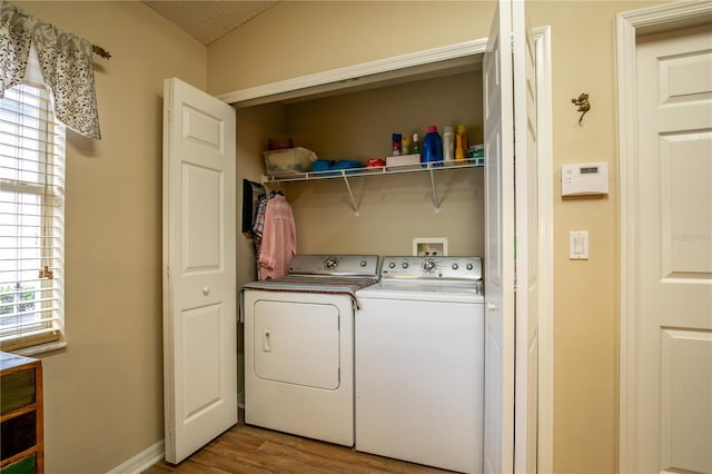 4083 Capland Ave, Clermont, FL 34711 - laundry area with independent washer and dryer, light wood finished floors, and baseboards