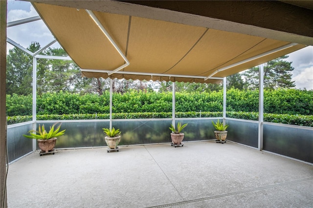 4083 Capland Ave, Clermont, FL 34711 - unfurnished sunroom featuring view of scattered trees