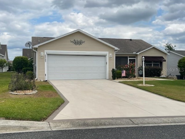 1723 Banberry Run, The Villages, FL 32162 - single story home with a garage, a front yard, and driveway