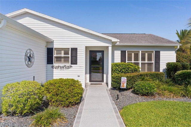 2785 Privada Dr, The Villages, FL 32162 - property entrance with a shingled roof