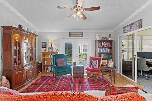 2785 Privada Dr, The Villages, FL 32162 - sitting room featuring wood finished floors, a desk, a ceiling fan, a textured ceiling, and french doors