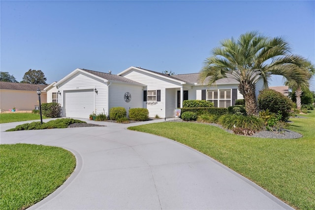 2785 Privada Dr, The Villages, FL 32162 - ranch-style house with driveway, an attached garage, and a front lawn