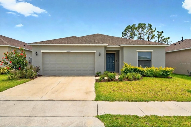33960 Sky Blossom Cir, Leesburg, FL 34788 - single story home featuring stucco siding, a garage, a front yard, and driveway