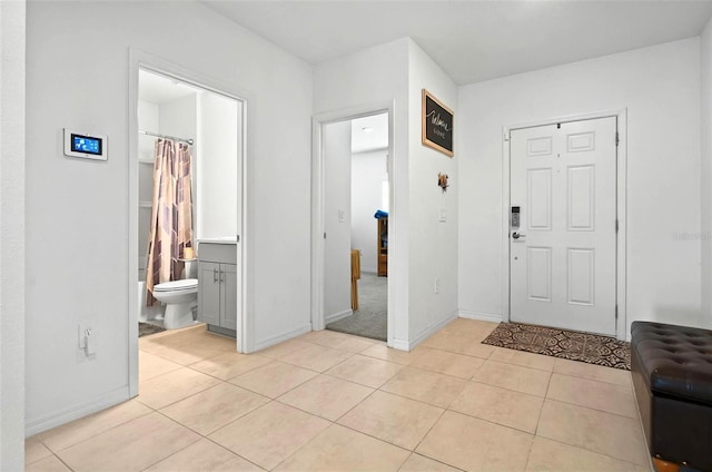 33960 Sky Blossom Cir, Leesburg, FL 34788 - foyer with light tile patterned floors and baseboards