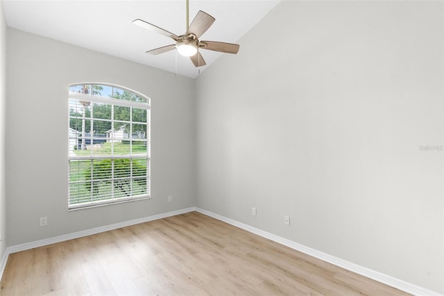 12838 Owasso Ln, Clermont, FL 34711 - spare room featuring light wood-style flooring, baseboards, vaulted ceiling, and ceiling fan