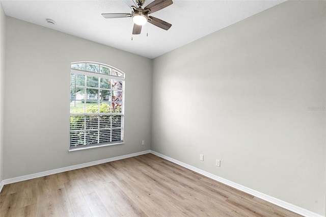 12838 Owasso Ln, Clermont, FL 34711 - unfurnished room featuring light wood finished floors, baseboards, ceiling fan, and a smoke detector