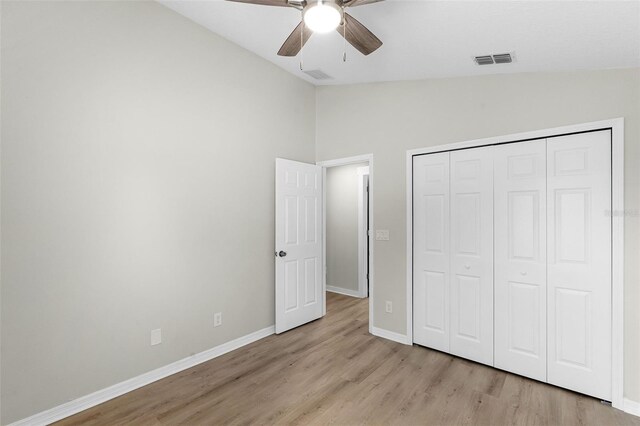 12838 Owasso Ln, Clermont, FL 34711 - unfurnished bedroom featuring vaulted ceiling, light wood-style floors, baseboards, a closet, and ceiling fan