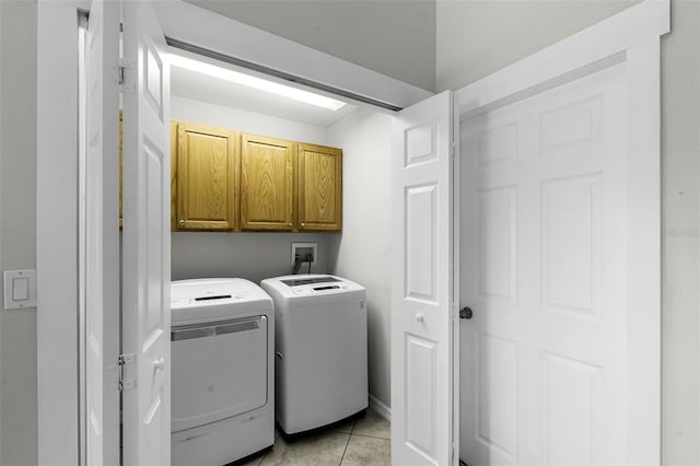 12838 Owasso Ln, Clermont, FL 34711 - washroom with cabinet space, separate washer and dryer, and light tile patterned flooring