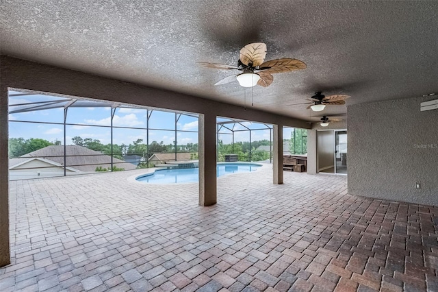 12838 Owasso Ln, Clermont, FL 34711 - outdoor pool with ceiling fan, a patio, a lanai, and an outdoor hot tub