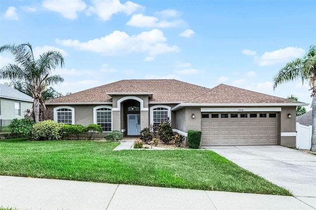 12838 Owasso Ln, Clermont, FL 34711 - ranch-style home with stucco siding, an attached garage, concrete driveway, and a shingled roof