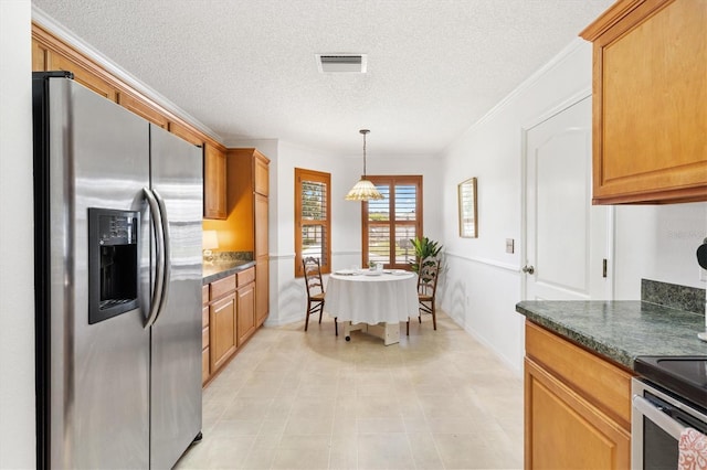 654 Fayette Ct, The Villages, FL 32162 - kitchen featuring stainless steel fridge, dark countertops, a textured ceiling, hanging light fixtures, and crown molding