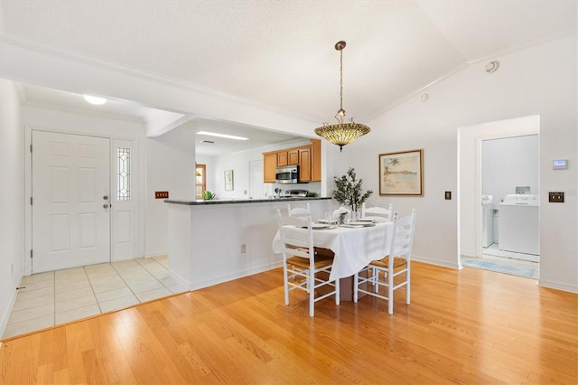 654 Fayette Ct, The Villages, FL 32162 - dining room featuring light wood-style floors, ornamental molding, baseboards, and lofted ceiling