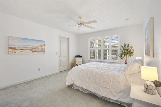 654 Fayette Ct, The Villages, FL 32162 - carpeted bedroom with a textured ceiling, baseboards, and ceiling fan