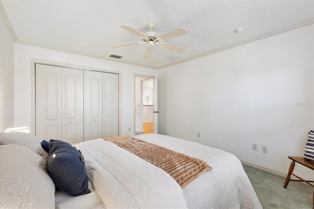 654 Fayette Ct, The Villages, FL 32162 - bedroom featuring carpet flooring, a closet, crown molding, ceiling fan, and baseboards