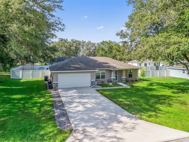 9364 SE 164th Pl, Summerfield, FL 34491 - ranch-style house featuring an attached garage, concrete driveway, stucco siding, a gate, and a shingled roof
