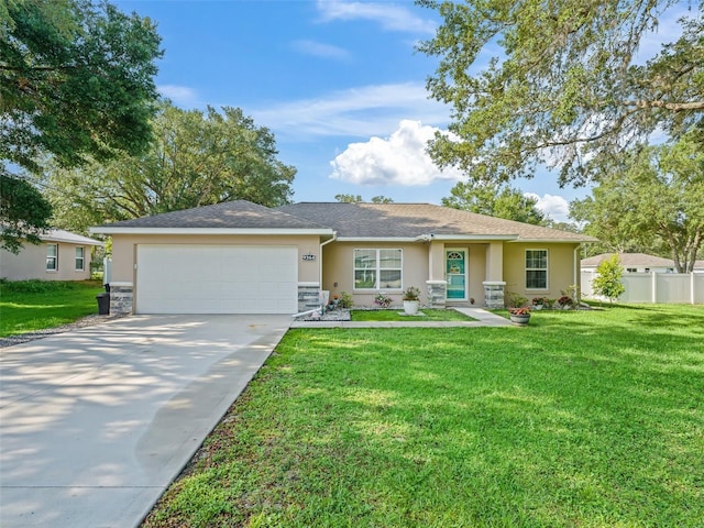 9364 SE 164th Pl, Summerfield, FL 34491 - single story home featuring a garage, concrete driveway, stucco siding, and stone siding