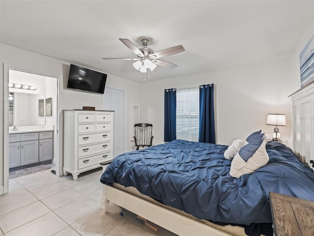 9364 SE 164th Pl, Summerfield, FL 34491 - bedroom featuring light tile patterned flooring, ensuite bathroom, ceiling fan, and a sink