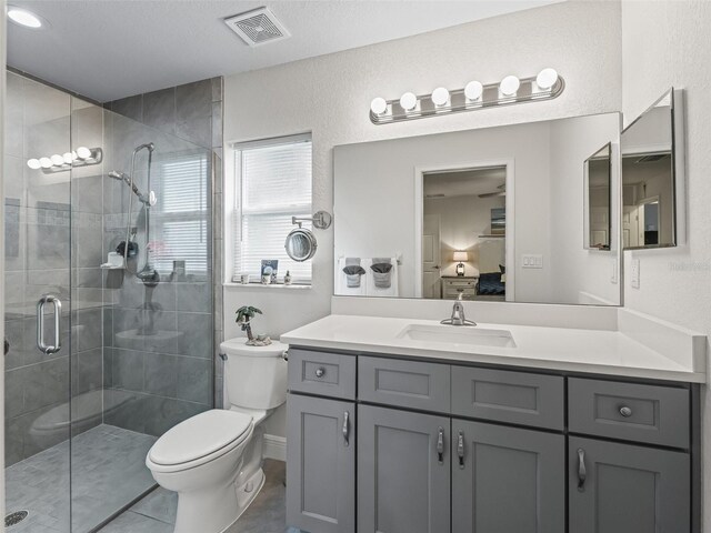 9364 SE 164th Pl, Summerfield, FL 34491 - ensuite bathroom featuring toilet, a stall shower, vanity, and tile patterned flooring