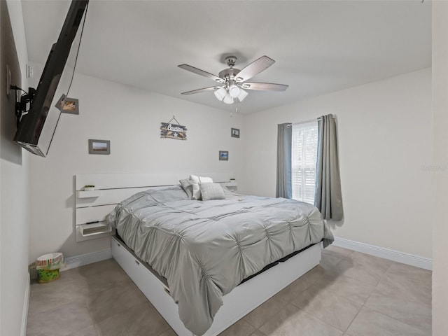 9364 SE 164th Pl, Summerfield, FL 34491 - bedroom with baseboards, light tile patterned flooring, and a ceiling fan