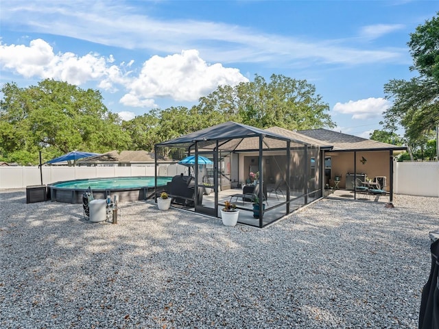 9364 SE 164th Pl, Summerfield, FL 34491 - back of property with a fenced backyard and a patio