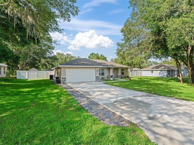 9364 SE 164th Pl, Summerfield, FL 34491 - ranch-style house featuring stucco siding, a garage, a gate, concrete driveway, and stone siding