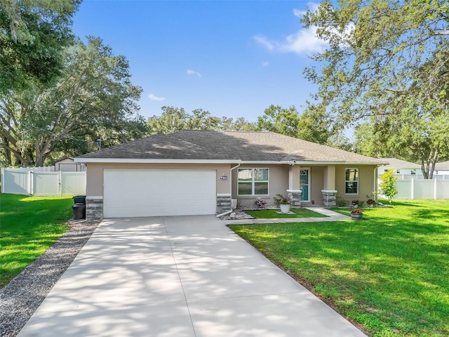 9364 SE 164th Pl, Summerfield, FL 34491 - ranch-style home with stucco siding, an attached garage, concrete driveway, and stone siding