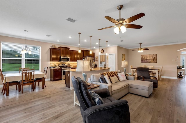 3809 Arlington Ridge Blvd, Leesburg, FL 34748 - living room with ceiling fan, ornamental molding, light wood finished floors, baseboards, and recessed lighting