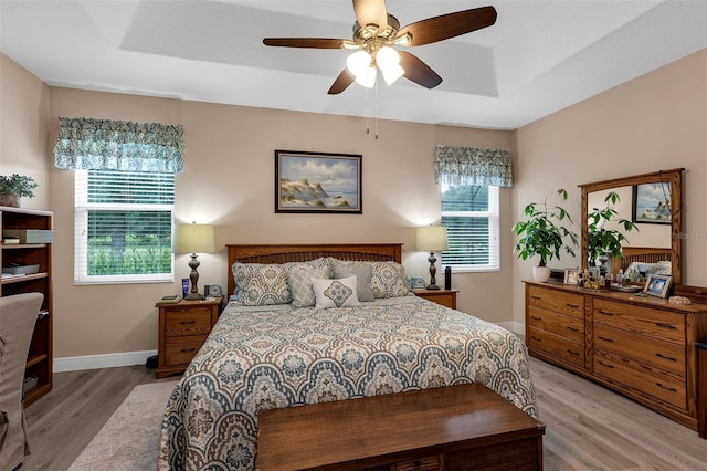 3809 Arlington Ridge Blvd, Leesburg, FL 34748 - bedroom with light wood-style flooring, multiple windows, baseboards, and ceiling fan