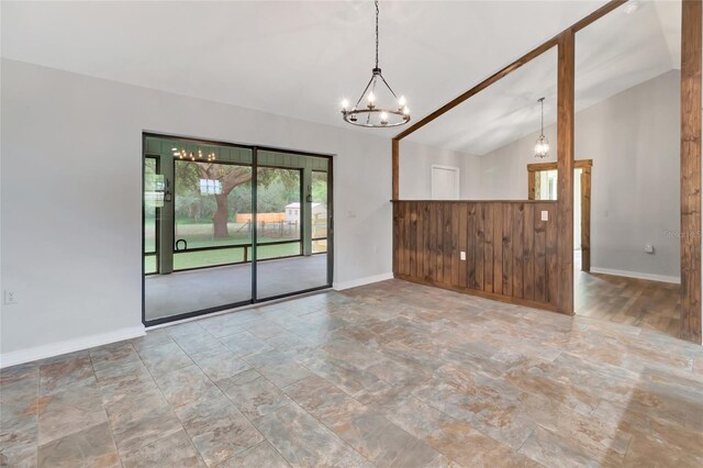 10330 Dwights Rd, Clermont, FL 34714 - empty room with a chandelier, lofted ceiling, baseboards, and stone finish floors