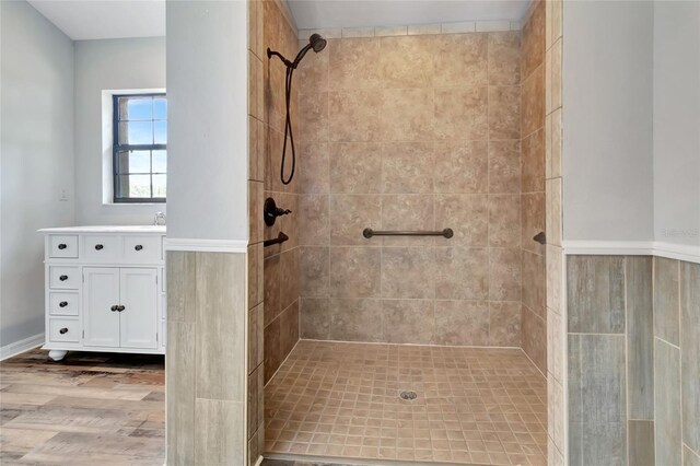 10330 Dwights Rd, Clermont, FL 34714 - full bathroom featuring tiled shower, vanity, and wood finished floors