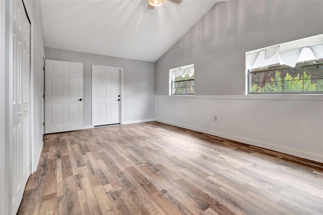 10330 Dwights Rd, Clermont, FL 34714 - unfurnished bedroom with wood finished floors, a closet, high vaulted ceiling, and baseboards