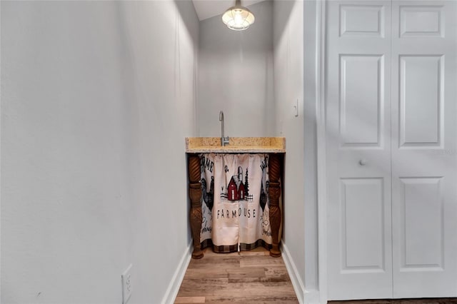 10330 Dwights Rd, Clermont, FL 34714 - corridor with light wood-style floors, baseboards, and a sink