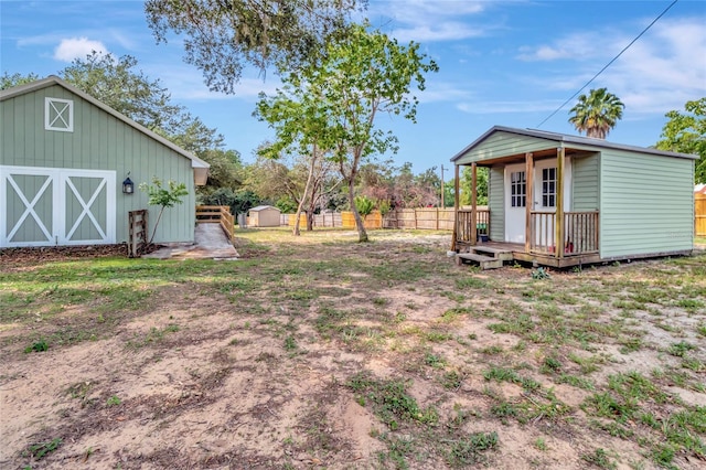 10330 Dwights Rd, Clermont, FL 34714 - view of yard featuring an outbuilding and a wooden deck