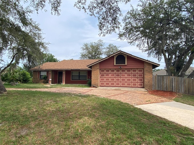 901 Baylor Dr, Deltona, FL 32725 - single story home with a garage, brick siding, and driveway