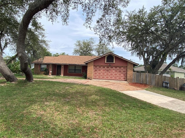 901 Baylor Dr, Deltona, FL 32725 - single story home featuring concrete driveway, an attached garage, and brick siding