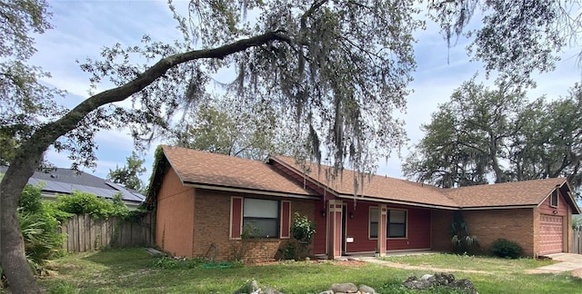 901 Baylor Dr, Deltona, FL 32725 - single story home with an attached garage, brick siding, and roof with shingles