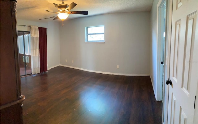 901 Baylor Dr, Deltona, FL 32725 - empty room with dark wood-style floors, a ceiling fan, baseboards, and a textured ceiling