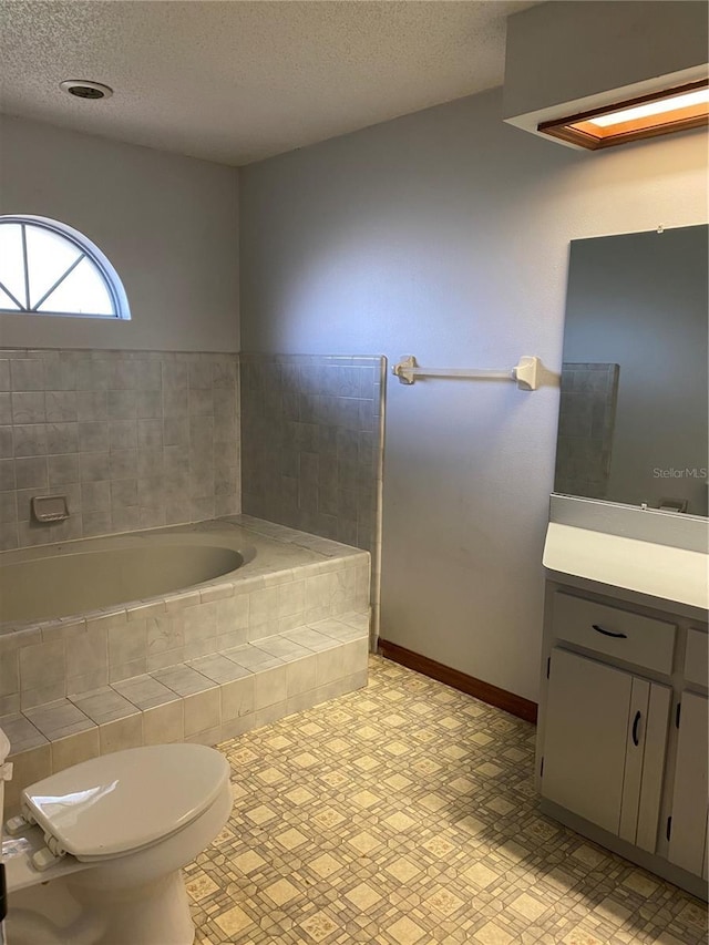 901 Baylor Dr, Deltona, FL 32725 - full bathroom with a bath, toilet, vanity, a textured ceiling, and tile patterned floors