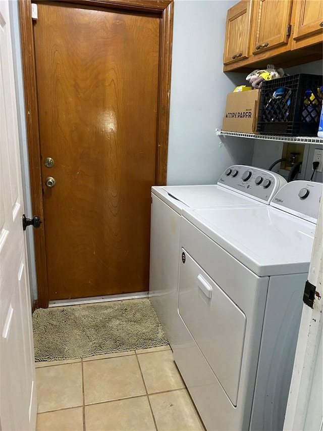 901 Baylor Dr, Deltona, FL 32725 - laundry room featuring cabinet space, washer and dryer, and light tile patterned flooring
