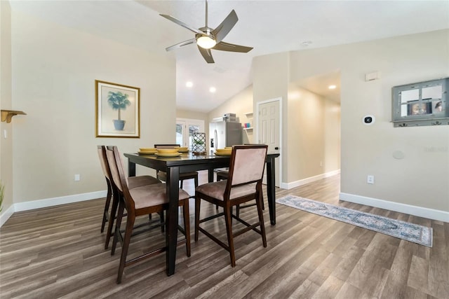 40140 Palm St, Lady Lake, FL 32159 - dining area with baseboards, wood finished floors, a ceiling fan, vaulted ceiling, and recessed lighting