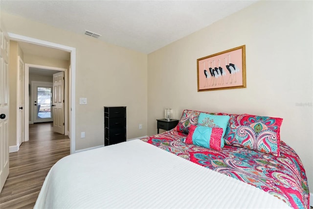 40140 Palm St, Lady Lake, FL 32159 - bedroom with wood finished floors and baseboards