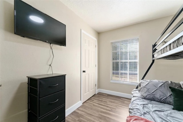 40140 Palm St, Lady Lake, FL 32159 - bedroom featuring light wood-style floors and baseboards