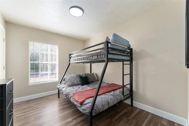 40140 Palm St, Lady Lake, FL 32159 - bedroom featuring baseboards, wood finished floors, and a textured ceiling