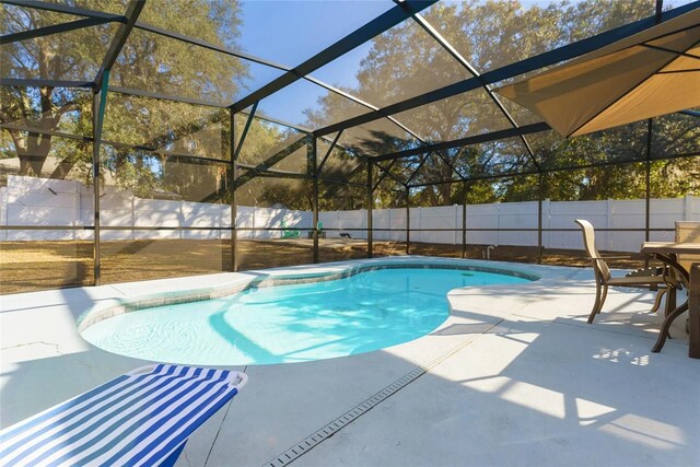 40140 Palm St, Lady Lake, FL 32159 - view of swimming pool featuring a patio, a fenced backyard, and glass enclosure