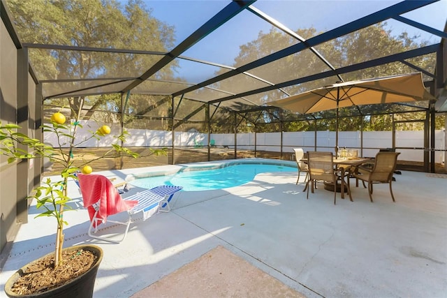 40140 Palm St, Lady Lake, FL 32159 - view of pool with a patio, a fenced backyard, outdoor dining area, and glass enclosure