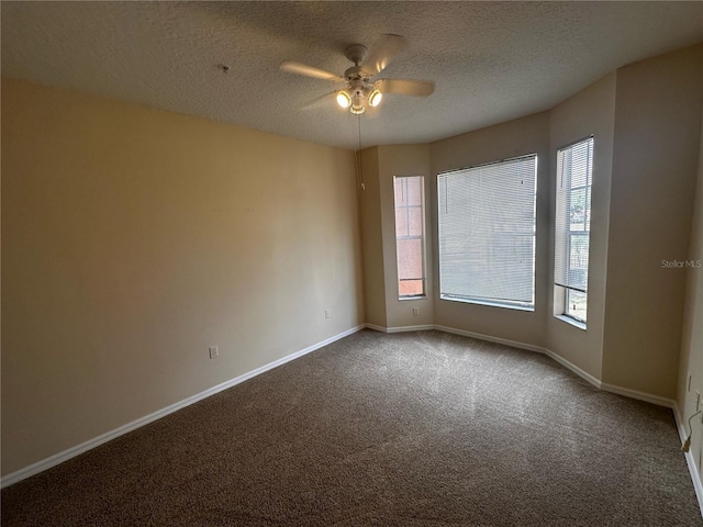5560 Metrowest Blvd Unit 3-204, Orlando, FL 32811 - spare room featuring carpet flooring, ceiling fan, a textured ceiling, and baseboards