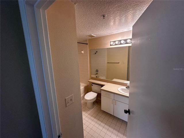 5560 Metrowest Blvd Unit 3-204, Orlando, FL 32811 - bathroom with tile patterned flooring, vanity, a textured ceiling, toilet, and  shower combination