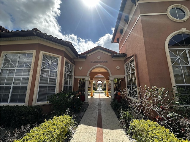 5560 Metrowest Blvd Unit 3-204, Orlando, FL 32811 - view of exterior entry featuring stucco siding and french doors