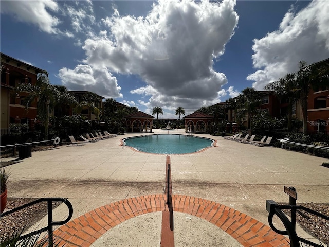 5560 Metrowest Blvd Unit 3-204, Orlando, FL 32811 - community pool with a patio and a gazebo