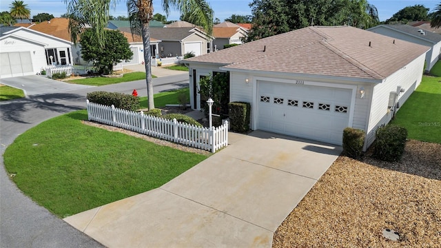 2111 Thornton Ter, The Villages, FL 32162 - view of front of home with a shingled roof, concrete driveway, a residential view, and an attached garage